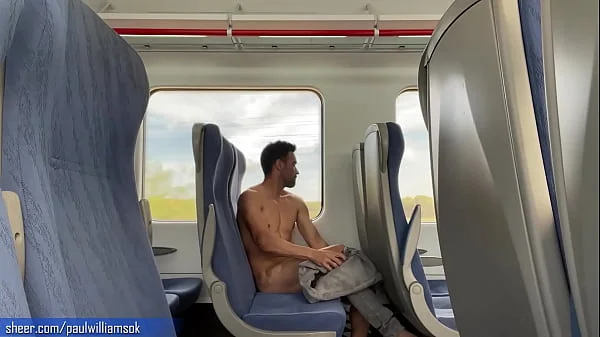 Sexy tanned man travelling naked by train. Very risky public nudity