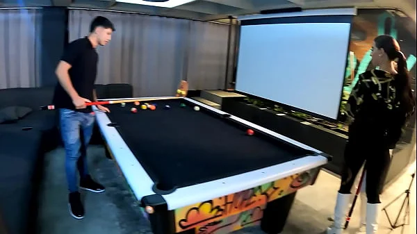 A threesome with two fiery Latinas on a pool table.