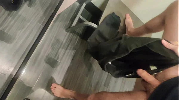 Pissing in a Fitting Room, Using a Pair of Pants