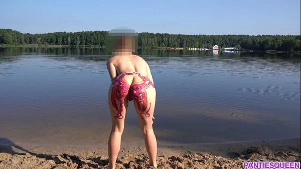 Naked girl goes skinny dipping in public beach