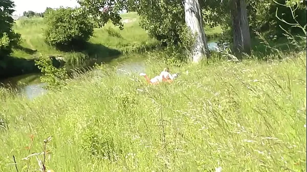 Milf sexy woman sunbathing naked on river bank. Random guy is watching. Naked in public. Public. Publicly. Wild beach Nudist. Perfect ass. Pussy. Blonde. Doggystyle. Woman got into doggy style position. Outdoor. Outside. Outdoors. Nudists. Naturist. POV