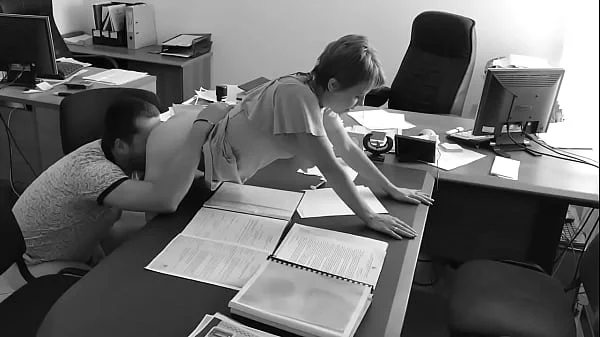 The boss fucks his tiny secretary on the office table and films it on hidden camera